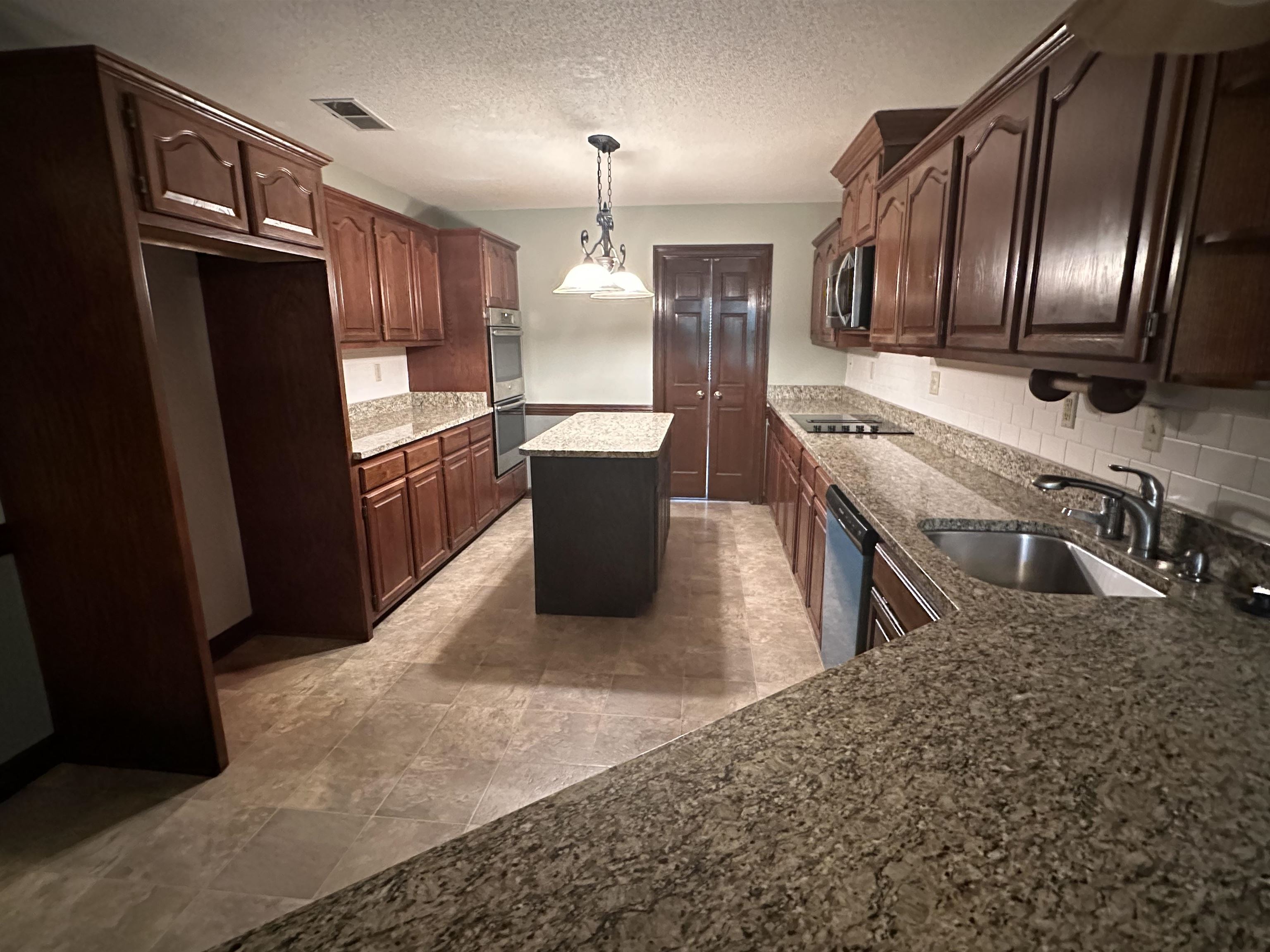 482 Brook Ridge Circle Memphis, TN 38018 - Photo 5 of 17 a kitchen with stainless steel appliances granite countertop a refrigerator a stove a sink and a refrigerator