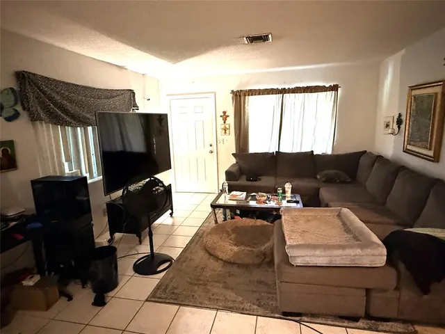 a bedroom with a bed and a mirror