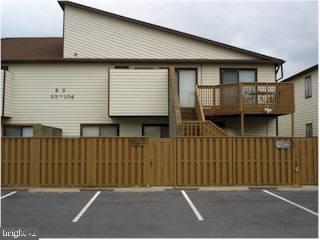0 Edward Taylor Road, Unit 101 Ocean City, MD 21842 - Photo 1 of 7 a side view of a house with a garage