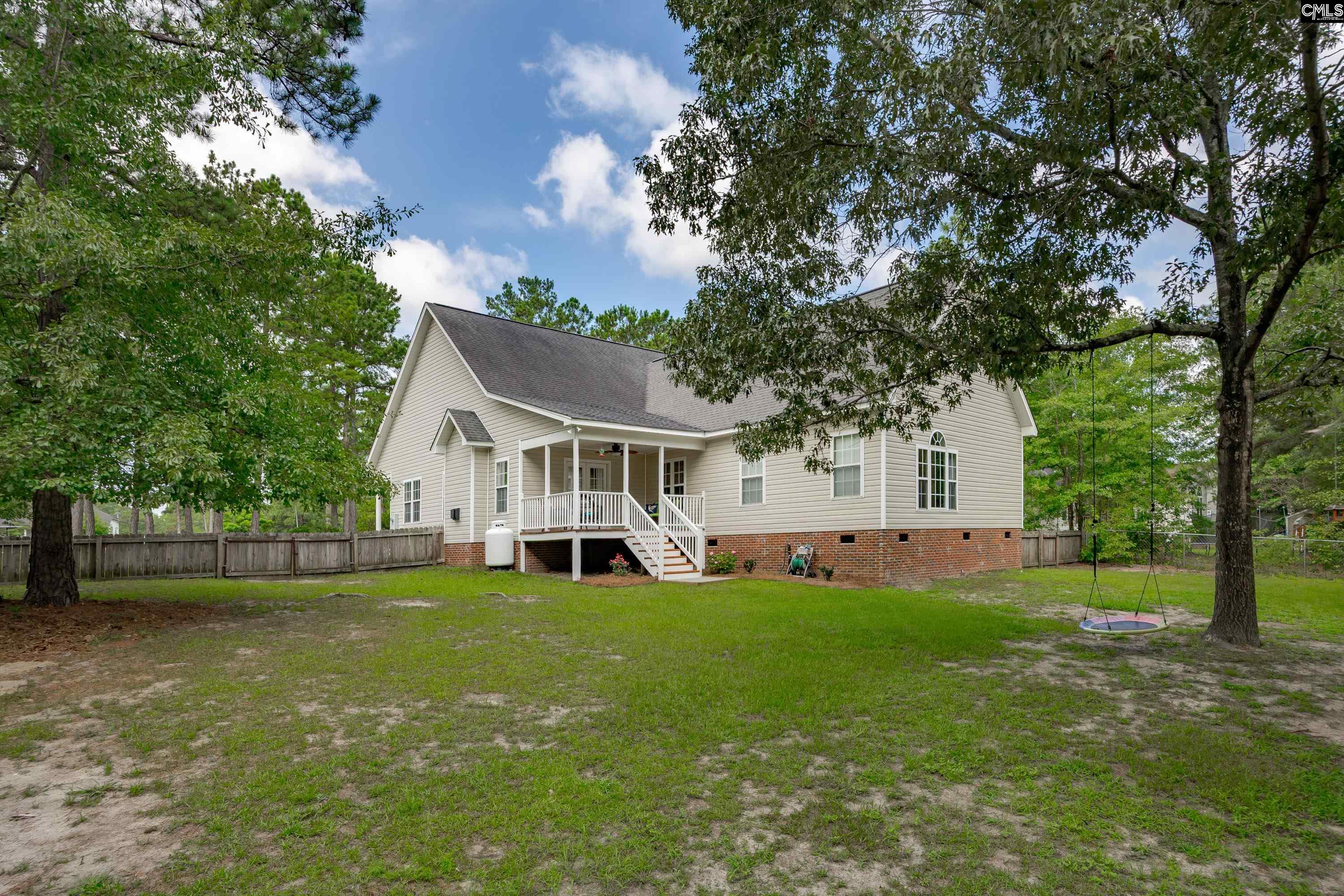 2032 Ridgeway Road Lugoff, SC 29078 - Photo 49 of 57 a view of a house with a big yard and large trees