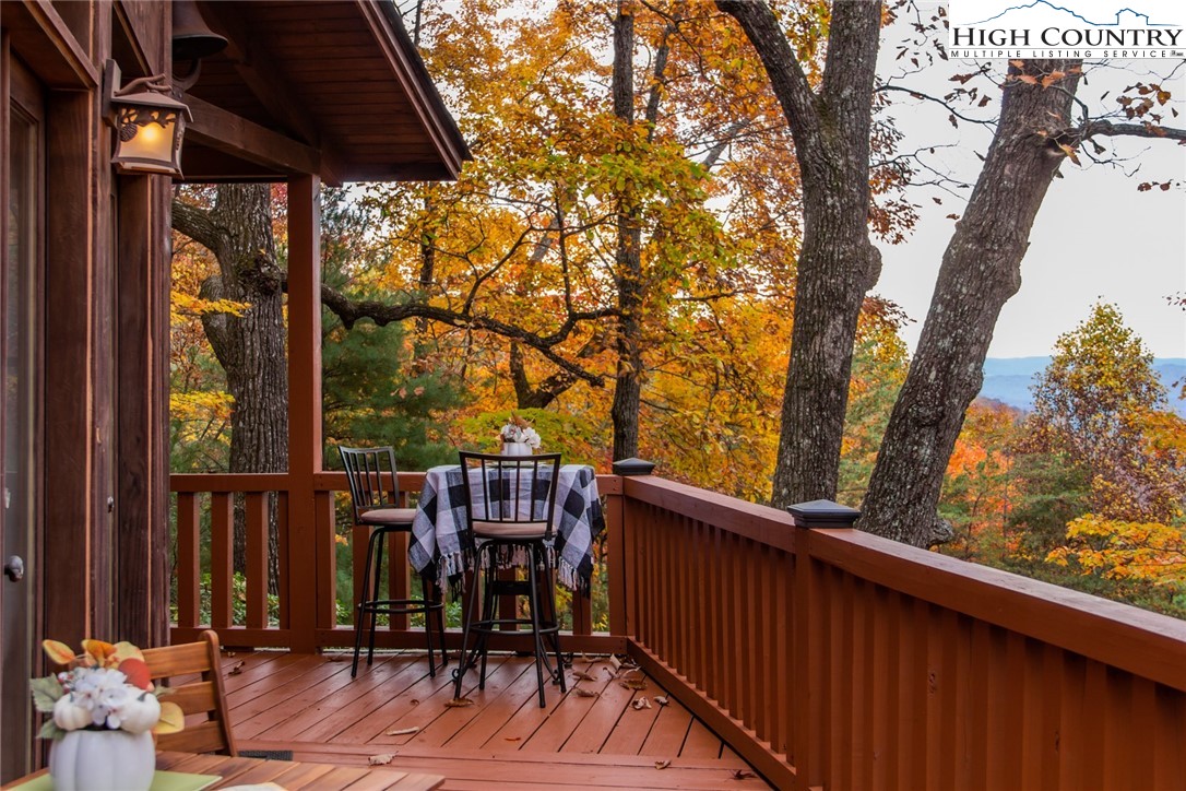 899 Bobcat Mountain Road Purlear, NC 28665 - Photo 1 of 50 a view of balcony with wooden floor and seating space