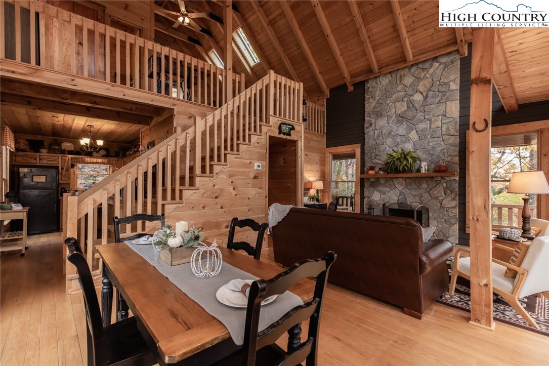 899 Bobcat Mountain Road Purlear, NC 28665 - Photo 11 of 50 a outdoor living room with furniture and a fireplace
