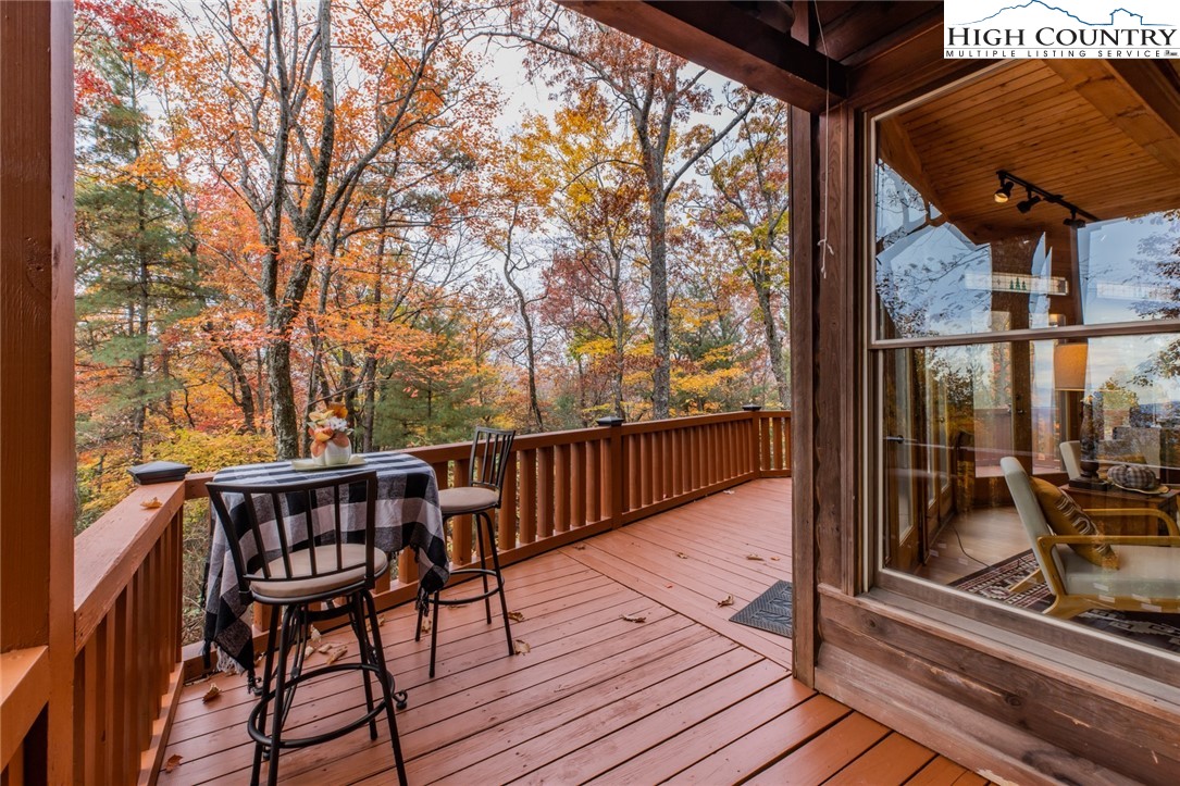 899 Bobcat Mountain Road Purlear, NC 28665 - Photo 15 of 50 a view of balcony with wooden floor and seating space