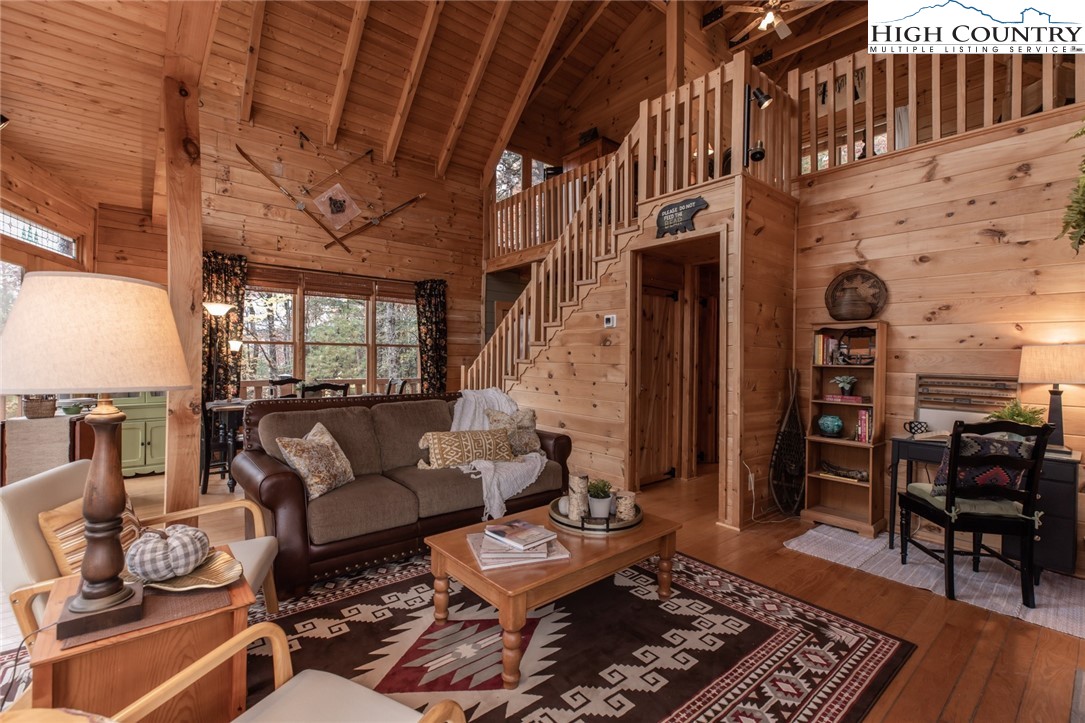 899 Bobcat Mountain Road Purlear, NC 28665 - Photo 18 of 50 a living room with furniture and wooden floor