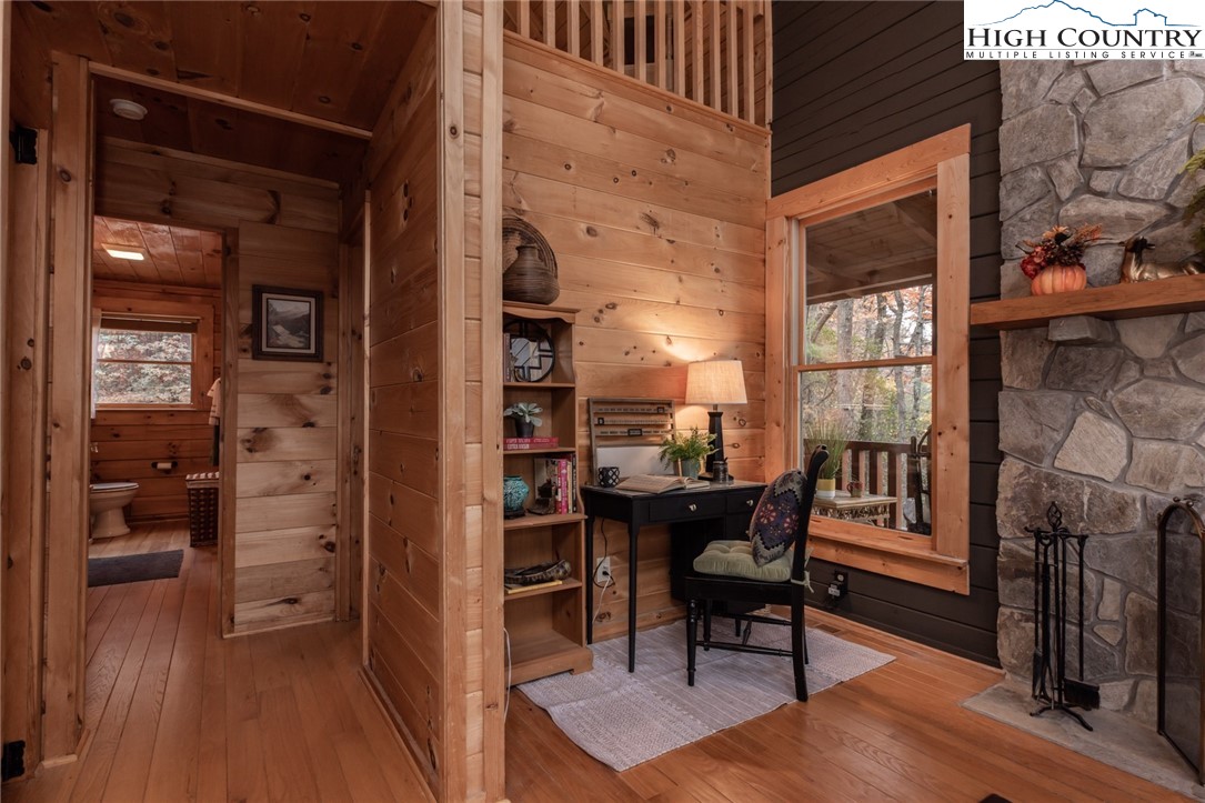 899 Bobcat Mountain Road Purlear, NC 28665 - Photo 21 of 50 a view of a livingroom with furniture and hardwood floor