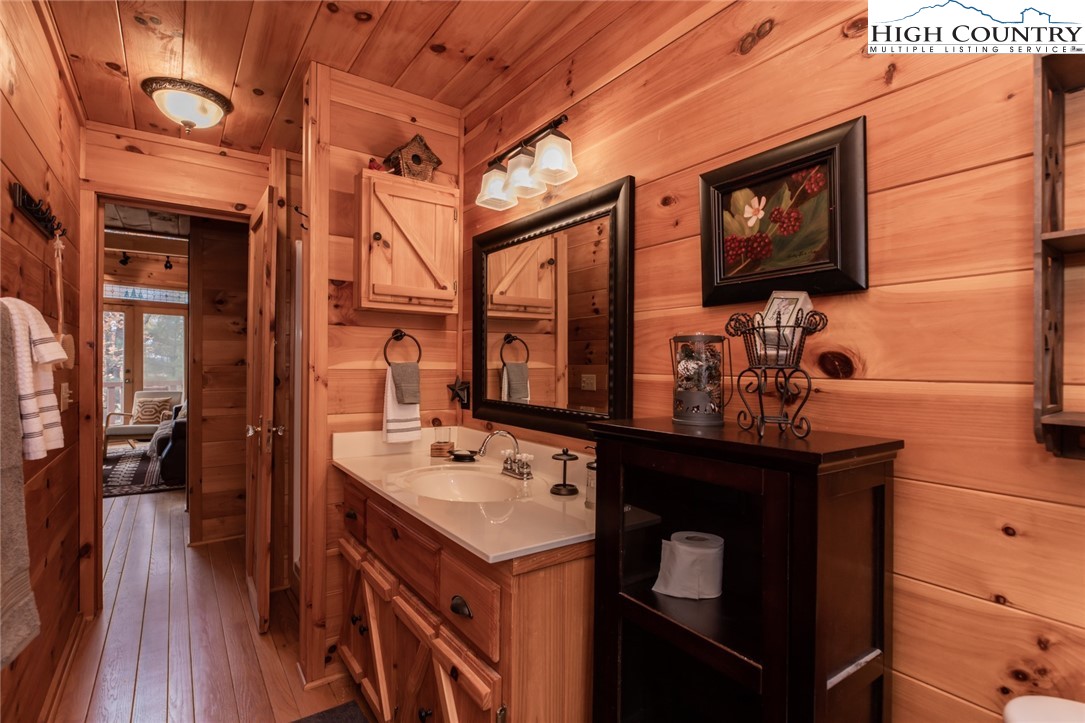 899 Bobcat Mountain Road Purlear, NC 28665 - Photo 27 of 50 a bathroom with a sink a mirror and a shower