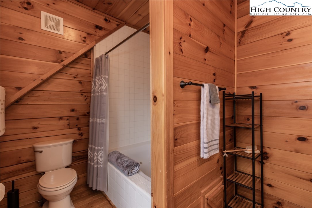 899 Bobcat Mountain Road Purlear, NC 28665 - Photo 33 of 50 a bathroom with a toilet and shower