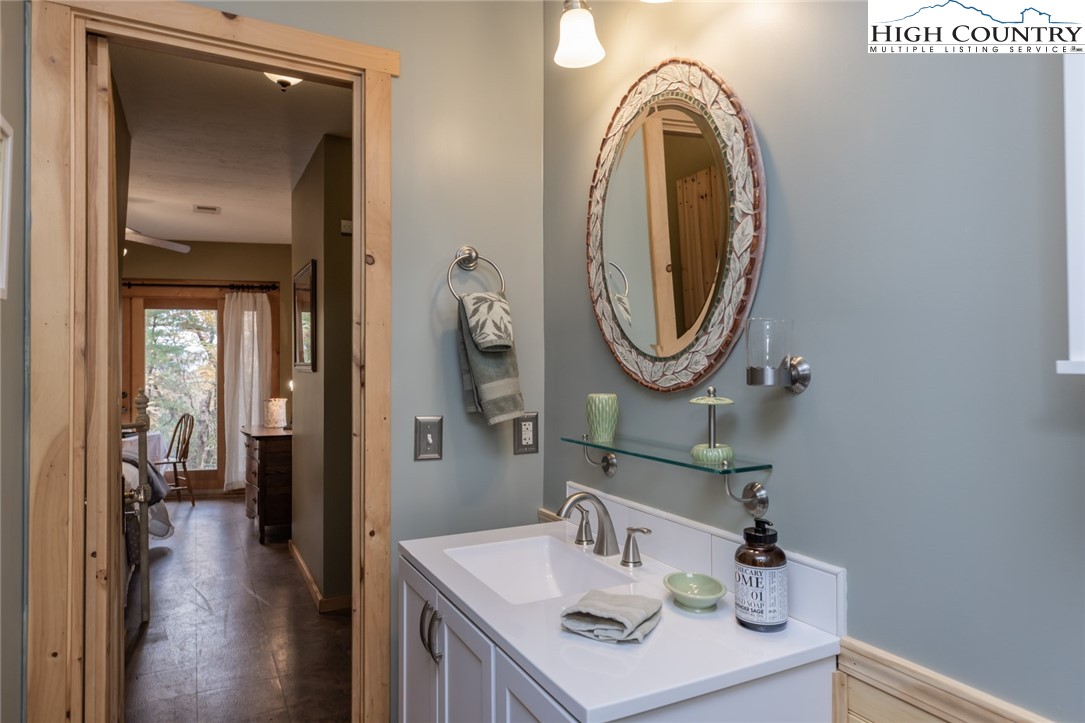 899 Bobcat Mountain Road Purlear, NC 28665 - Photo 47 of 50 a bathroom with a sink and a mirror