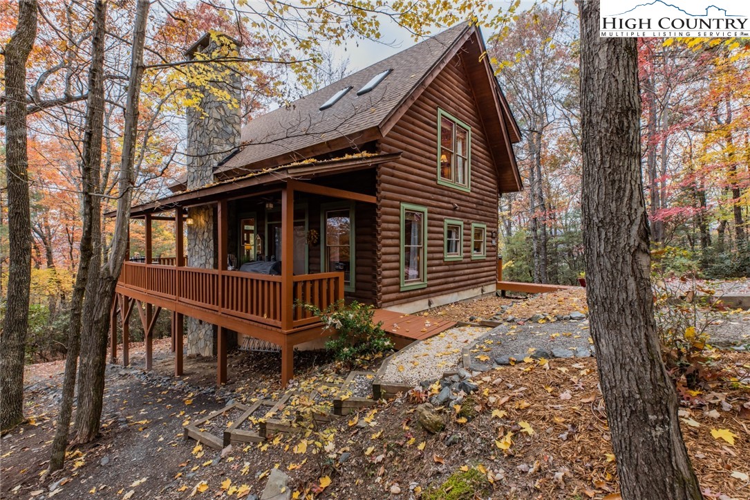 899 Bobcat Mountain Road Purlear, NC 28665 - Photo 49 of 50 a view of a house with a yard