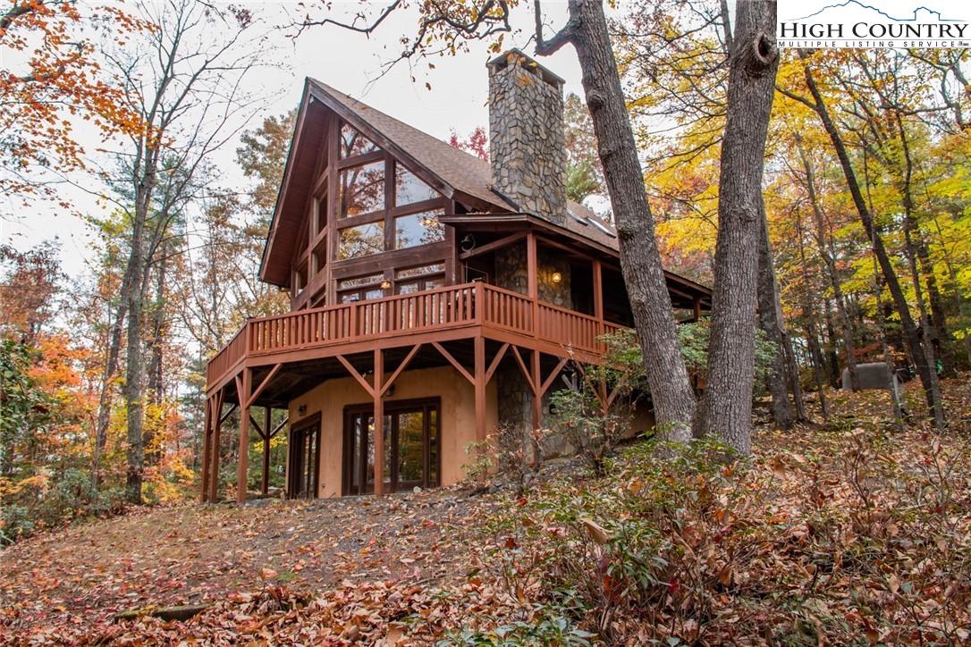 899 Bobcat Mountain Road Purlear, NC 28665 - Photo 50 of 50 front view of a house with a yard