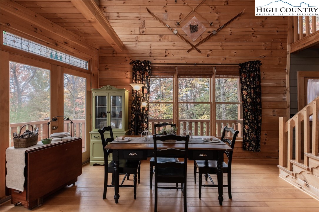 899 Bobcat Mountain Road Purlear, NC 28665 - Photo 9 of 50 a view of a dining room with furniture window and outside view