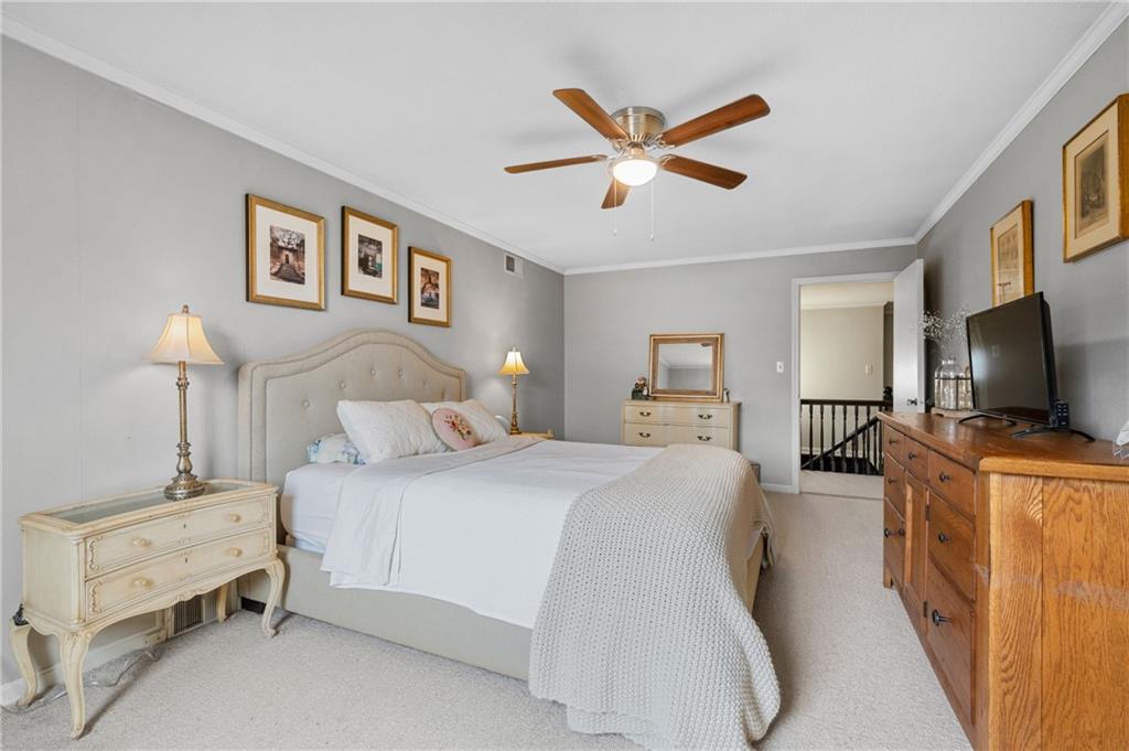 720 Wible Run Road Pittsburgh, PA 15209 - Photo 11 of 24 a bedroom with a bed and a flat screen tv