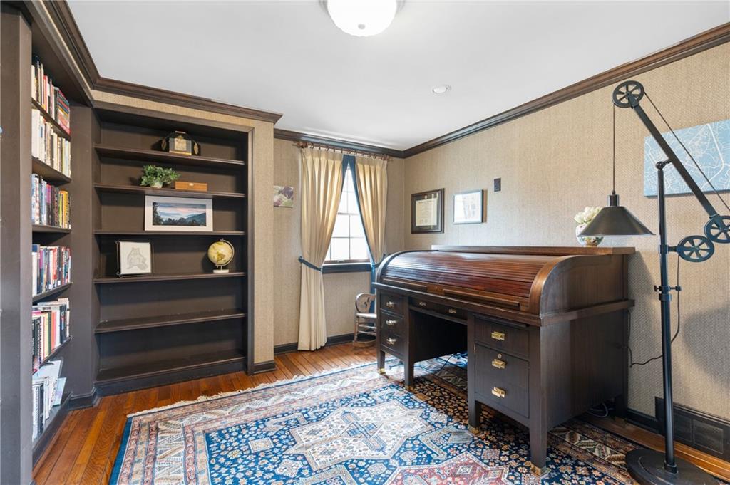 720 Wible Run Road Pittsburgh, PA 15209 - Photo 12 of 24 a room that has a bed and a bookshelf in it