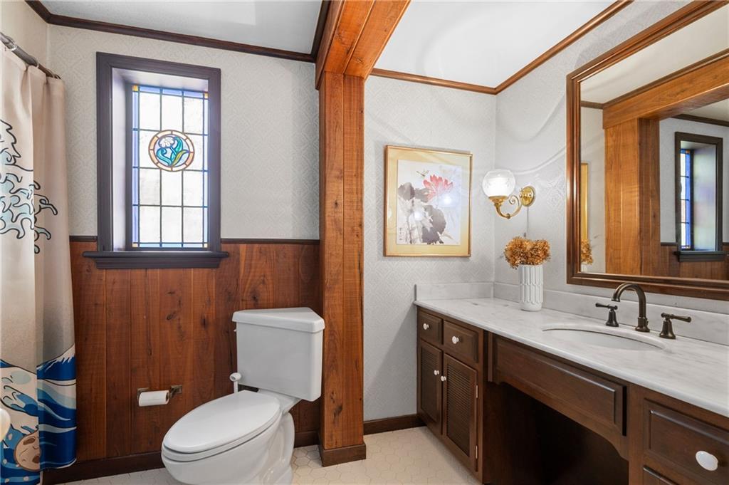 720 Wible Run Road Pittsburgh, PA 15209 - Photo 14 of 24 a bathroom with a granite countertop toilet sink and mirror