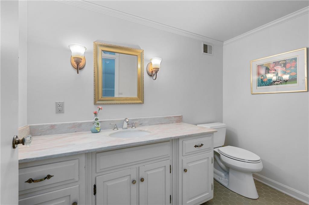 720 Wible Run Road Pittsburgh, PA 15209 - Photo 17 of 24 a bathroom with a toilet sink and mirror