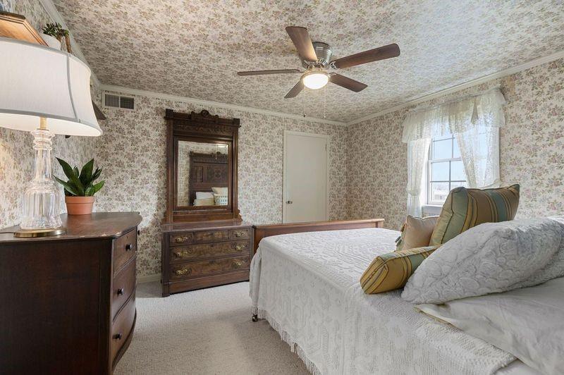 720 Wible Run Road Pittsburgh, PA 15209 - Photo 18 of 24 a bedroom with a large bed and ceiling fan