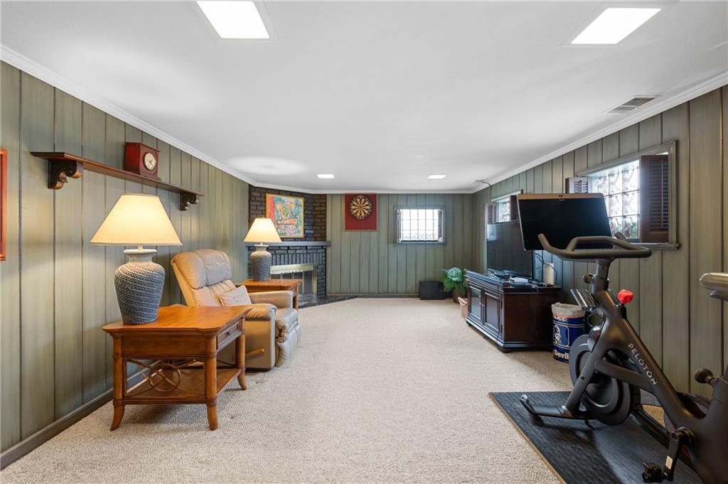 720 Wible Run Road Pittsburgh, PA 15209 - Photo 20 of 24 a living room with furniture and a flat screen tv