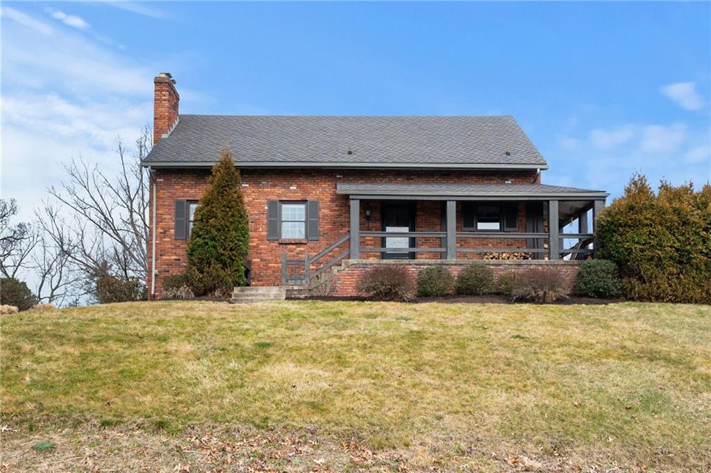 720 Wible Run Road Pittsburgh, PA 15209 - Photo 2 of 24 a front view of a house with garage