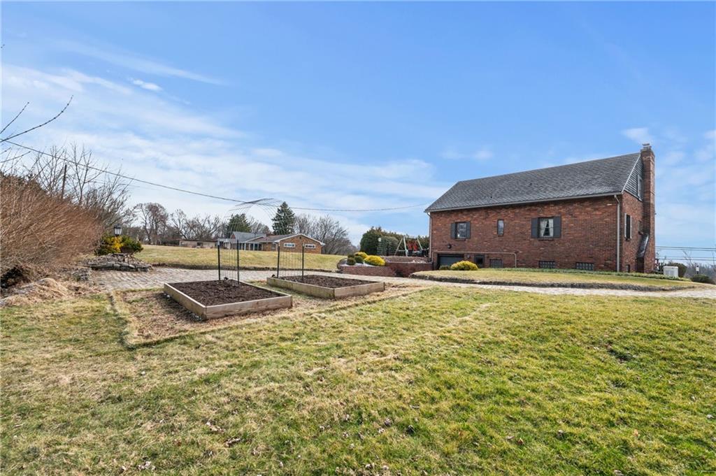 720 Wible Run Road Pittsburgh, PA 15209 - Photo 23 of 24 a view of a house with a yard