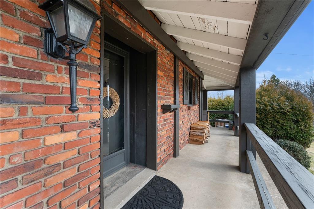 720 Wible Run Road Pittsburgh, PA 15209 - Photo 3 of 24 a view of balcony with couch and wooden floor