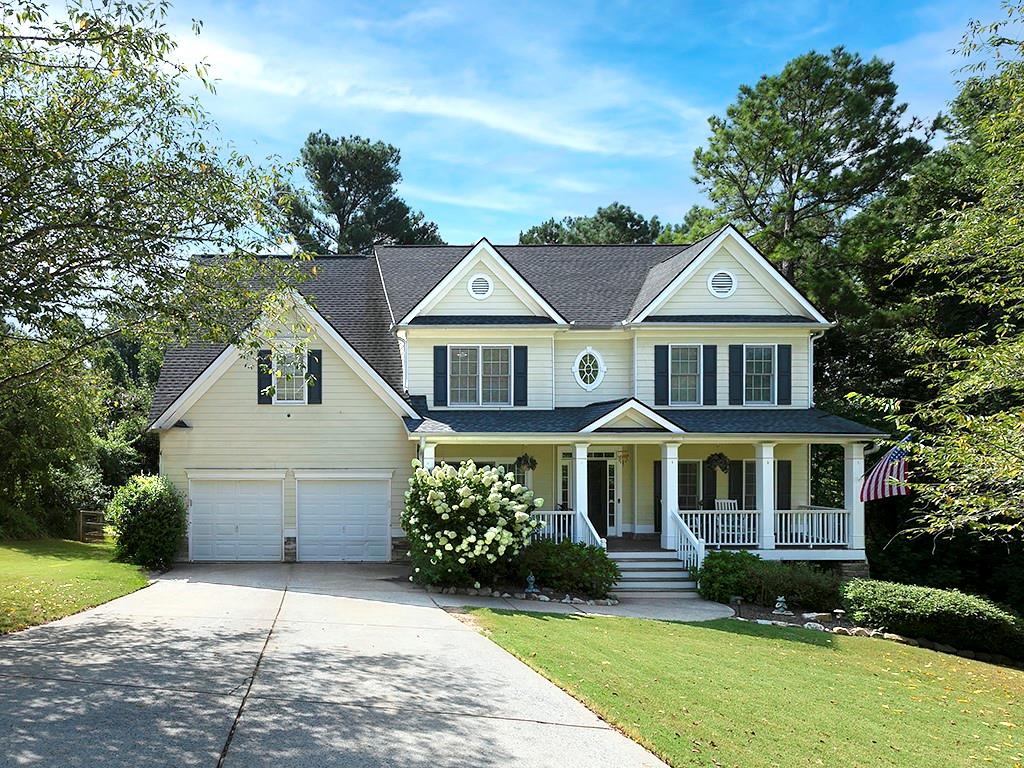117 Constitution Pointe Dallas, GA 30132 - Photo 1 of 50 a front view of a house with a yard and garage