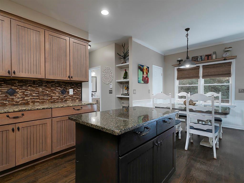 117 Constitution Pointe Dallas, GA 30132 - Photo 15 of 50 a kitchen with granite countertop a sink stove and cabinets