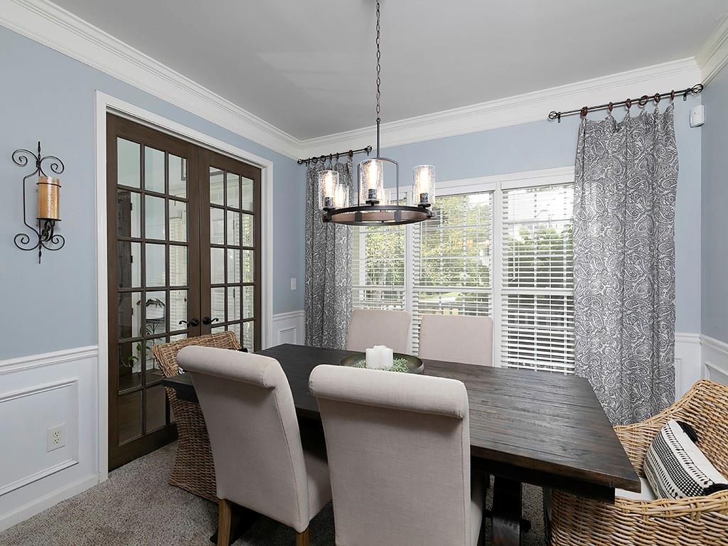 117 Constitution Pointe Dallas, GA 30132 - Photo 18 of 50 a view of a dining room with furniture window and outside view