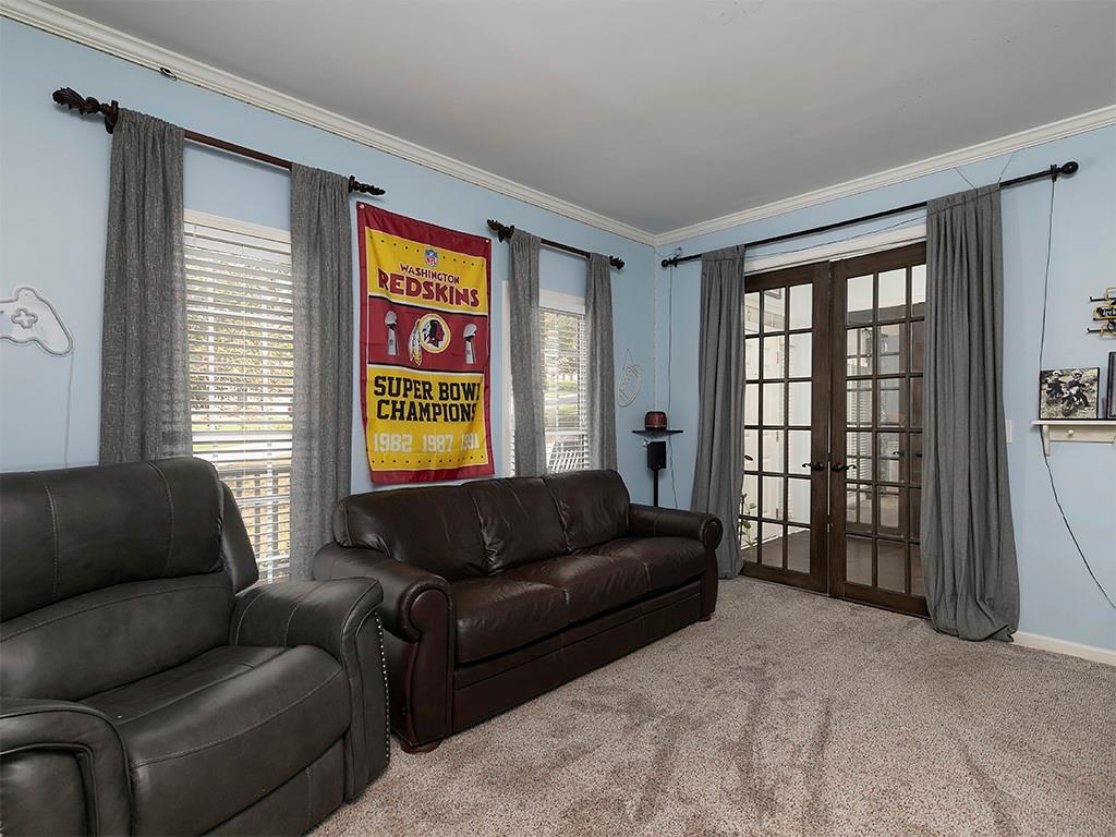 117 Constitution Pointe Dallas, GA 30132 - Photo 19 of 50 a living room with furniture and a window