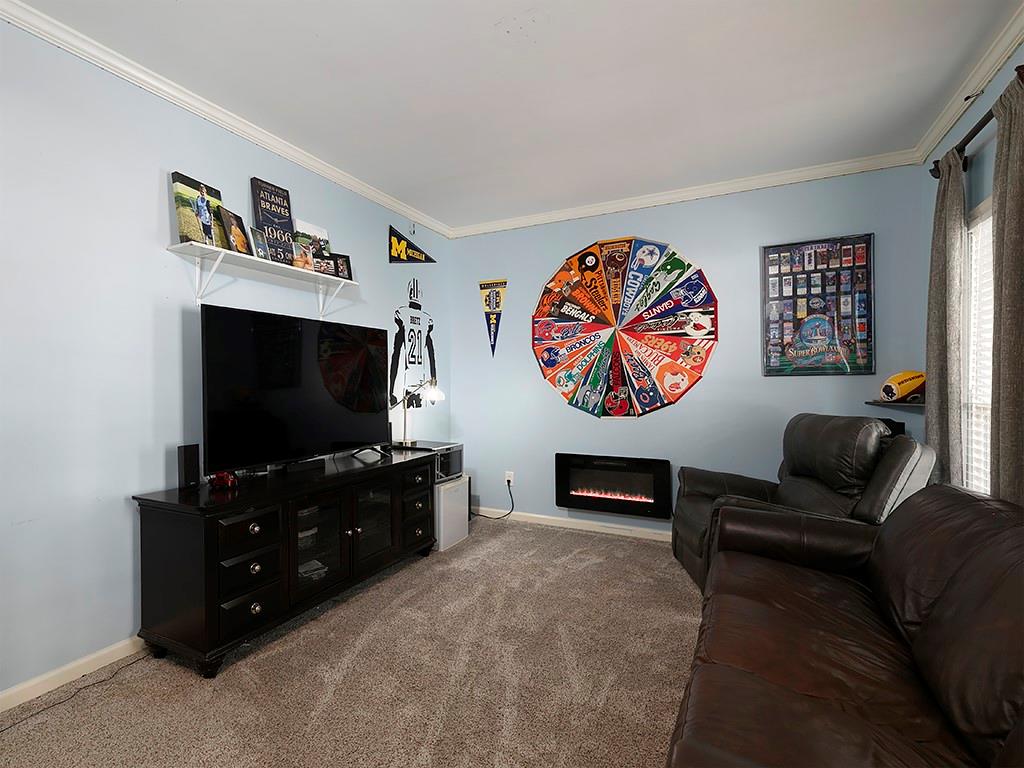 117 Constitution Pointe Dallas, GA 30132 - Photo 20 of 50 a living room with furniture and a flat screen tv