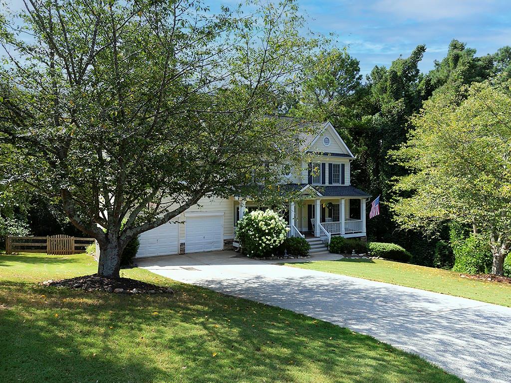 117 Constitution Pointe Dallas, GA 30132 - Photo 2 of 50 a front view of a house with a yard