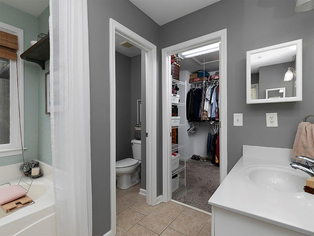 117 Constitution Pointe Dallas, GA 30132 - Photo 26 of 50 a bathroom with a sink and mirror with toilet