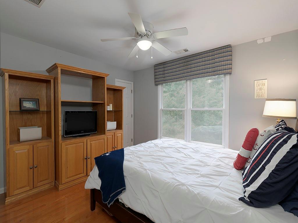 117 Constitution Pointe Dallas, GA 30132 - Photo 28 of 50 a bedroom with a bed flat screen tv and a window