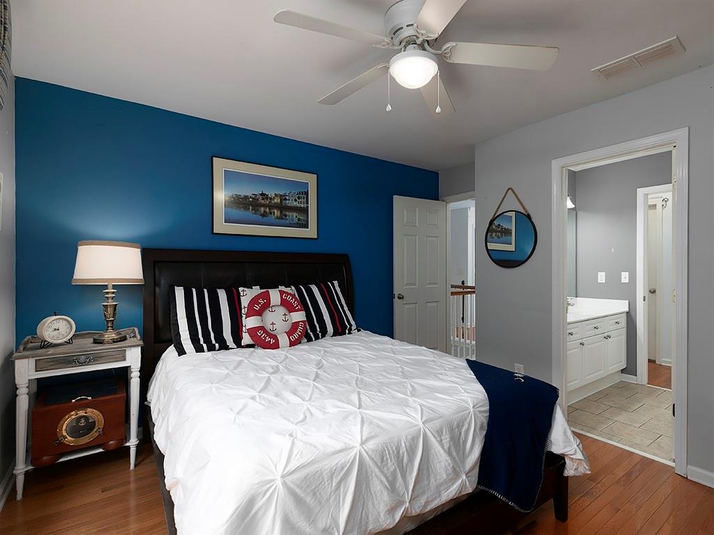 117 Constitution Pointe Dallas, GA 30132 - Photo 29 of 50 a bedroom with a bed and a chandelier