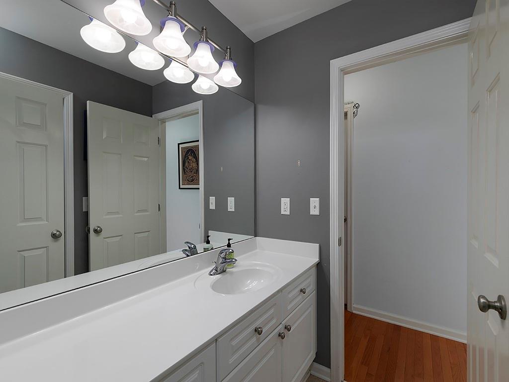 117 Constitution Pointe Dallas, GA 30132 - Photo 30 of 50 a bathroom with a sink vanity and a mirror
