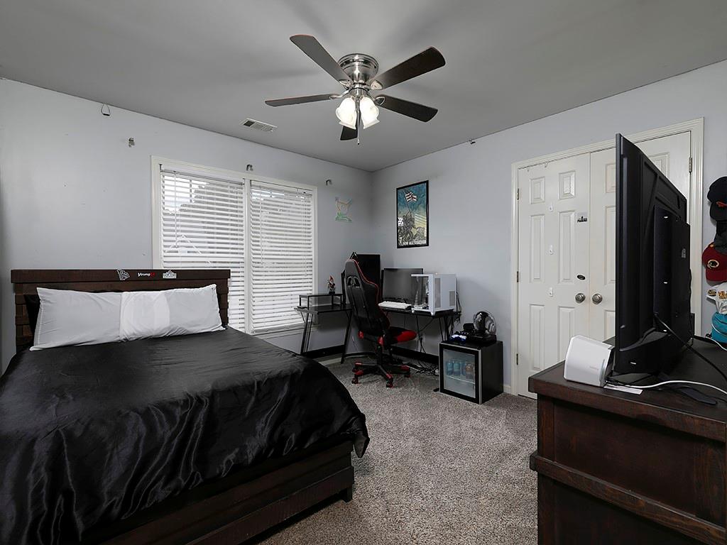 117 Constitution Pointe Dallas, GA 30132 - Photo 32 of 50 a bedroom with a bed and a couch