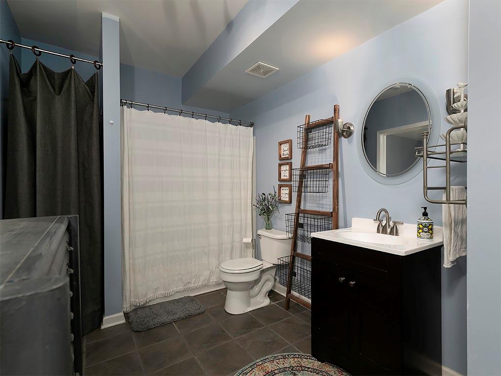 117 Constitution Pointe Dallas, GA 30132 - Photo 35 of 50 a bathroom with a sink toilet and shower