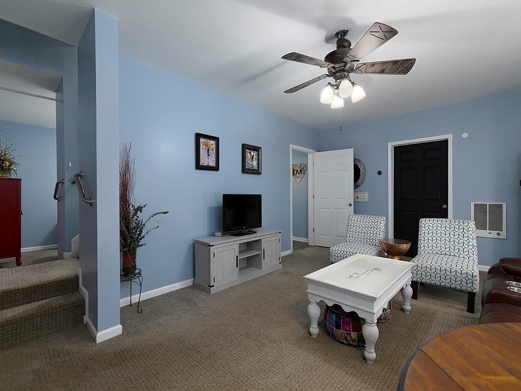 117 Constitution Pointe Dallas, GA 30132 - Photo 37 of 50 a living room with furniture and a flat screen tv