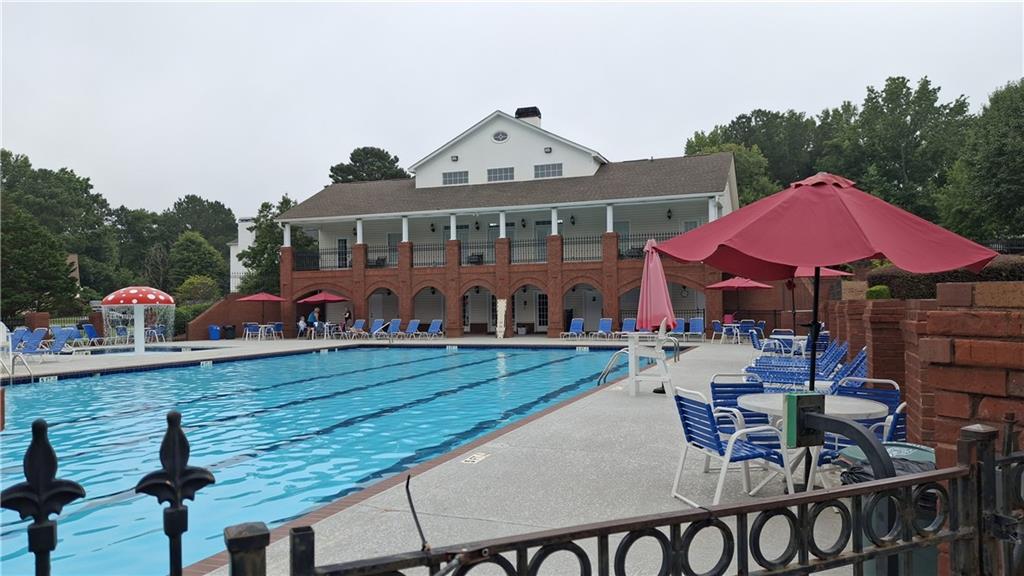 117 Constitution Pointe Dallas, GA 30132 - Photo 48 of 50 a front view of a house with garden and chairs