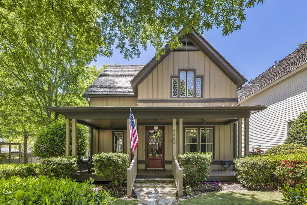 front view of a house with potted plants