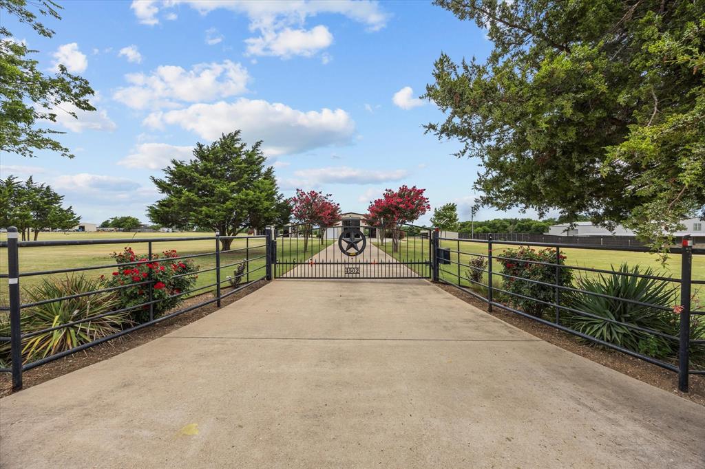 4502 Skinner Road Midlothian, TX 76065 - Photo 1 of 1 a view of pathway with a wrought fence