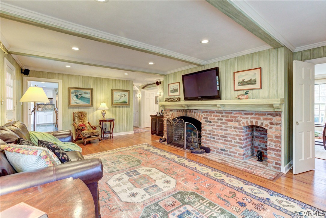 9810 Kingsbridge Road Henrico, VA 23238 - Photo 12 of 32 a living room with furniture a fireplace and a flat screen tv