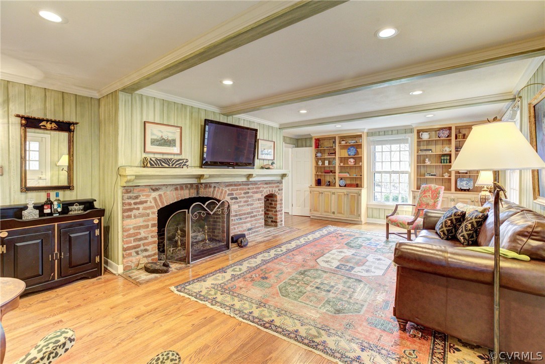 9810 Kingsbridge Road Henrico, VA 23238 - Photo 13 of 32 a living room with furniture a fireplace and a flat screen tv