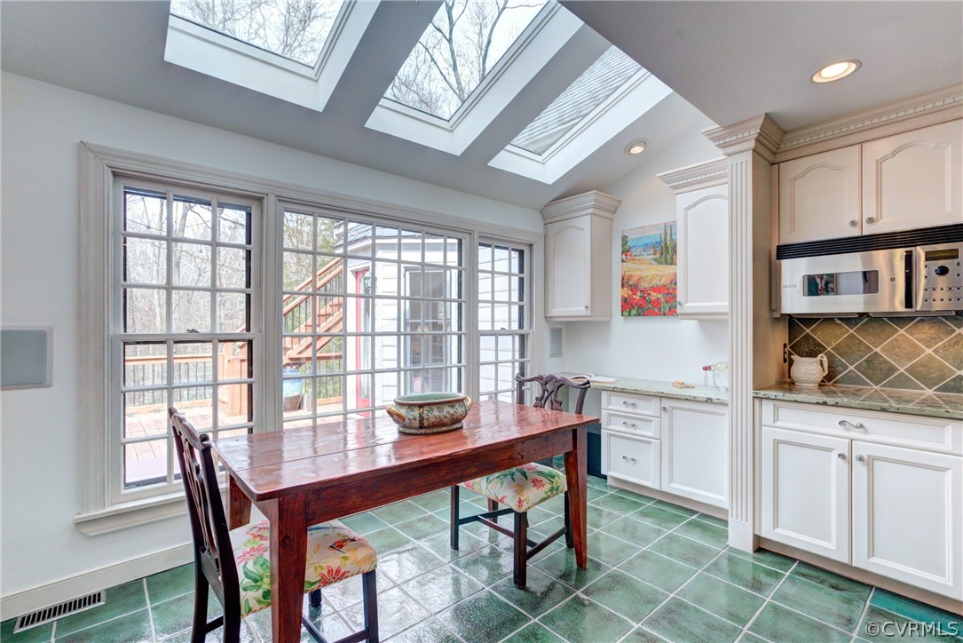 9810 Kingsbridge Road Henrico, VA 23238 - Photo 18 of 32 a view of a dining room with furniture and wooden floor