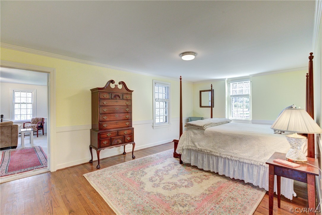 9810 Kingsbridge Road Henrico, VA 23238 - Photo 22 of 32 a bedroom with a bed and wooden floor