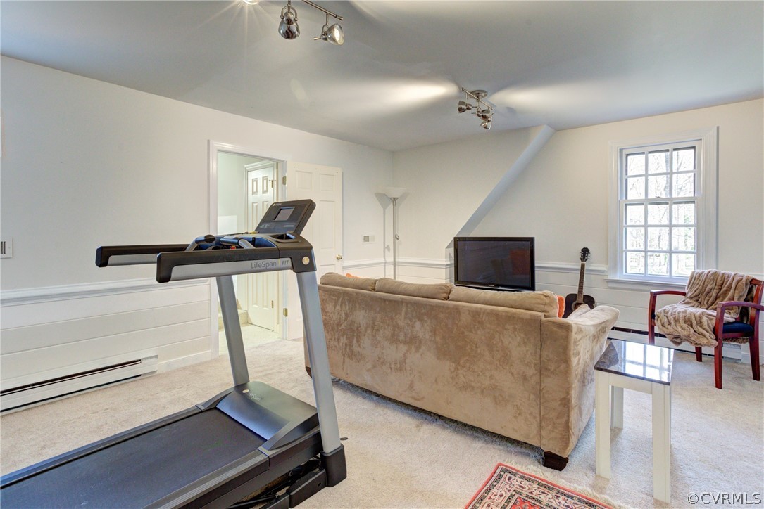 9810 Kingsbridge Road Henrico, VA 23238 - Photo 23 of 32 a living room with furniture and a flat screen tv