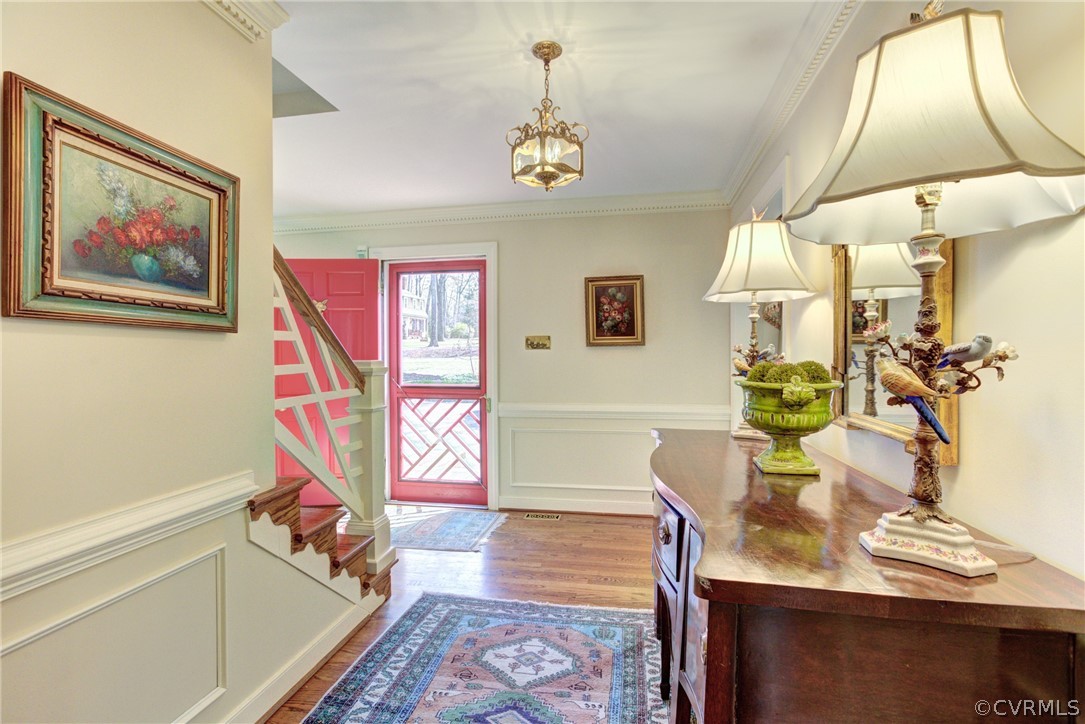 9810 Kingsbridge Road Henrico, VA 23238 - Photo 6 of 32 a living room with furniture and a chandelier