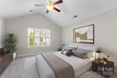 a bedroom with bed and a window