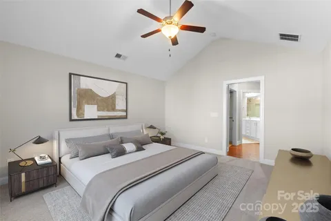 a bedroom with bed and window