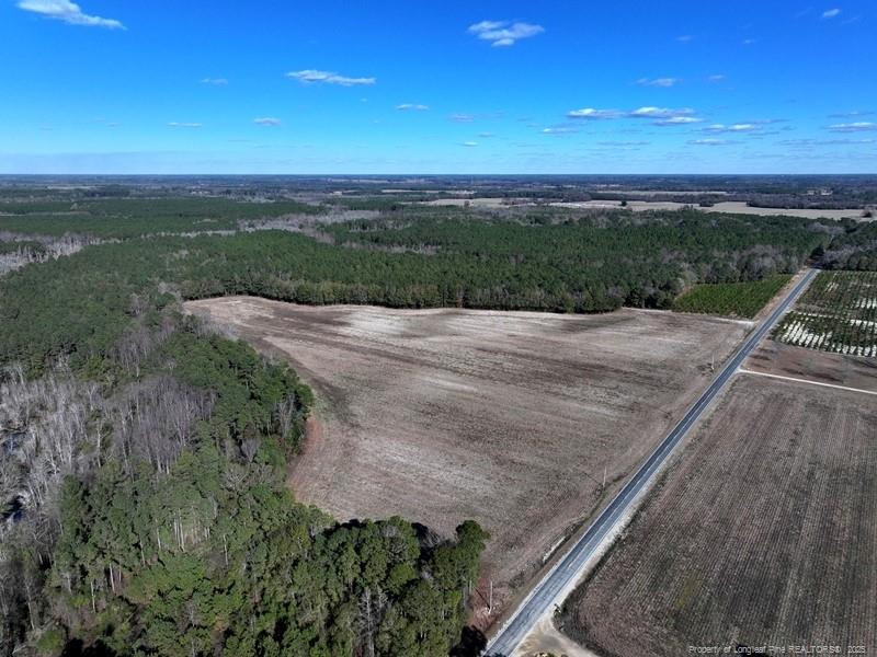 a view of a street with an ocean