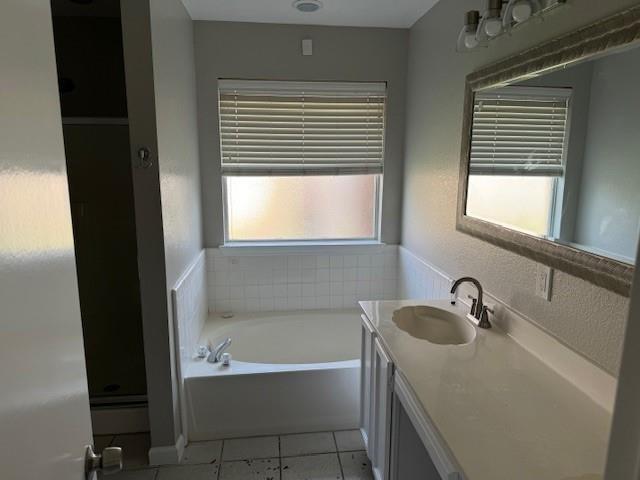 2700 Whetstone Drive Corinth, TX 76210 - Photo 11 of 12 a bathroom with a sink and a bathtub